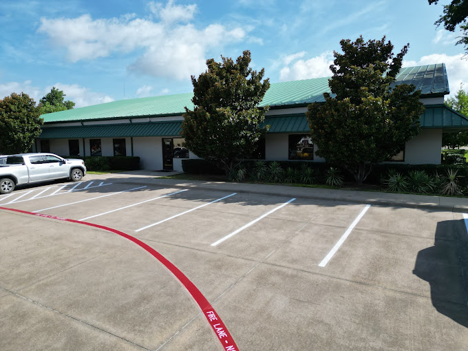 Bilbo Transports office building with green metal roof in Irving, Texas